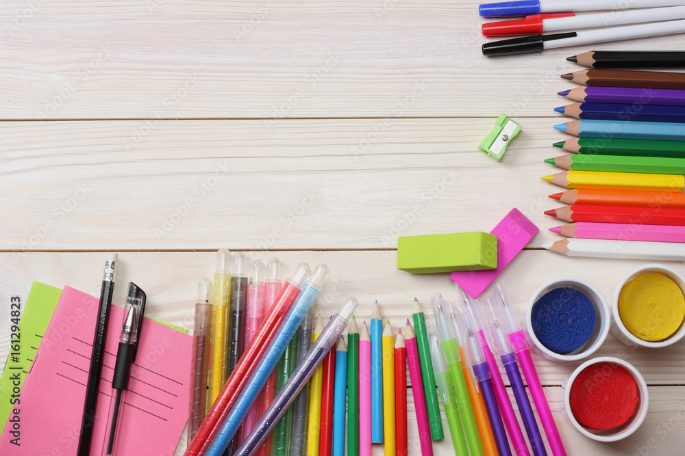 Background Paper, Colored pencils, pens, markers and some art stuff on  painted wooden surface. Place for text. Top view with copy space Stock  Photo