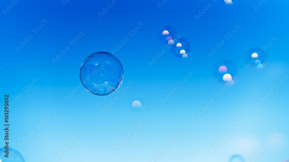 Soap bubbles. Blue sky as background.