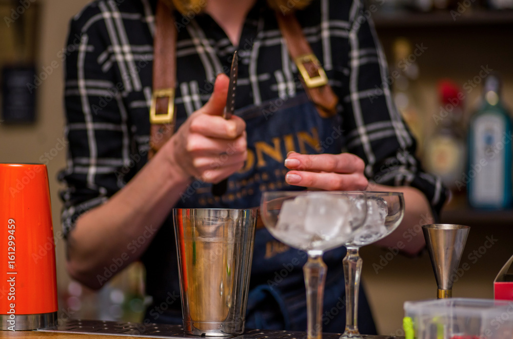 Bartender prepares a cocktail