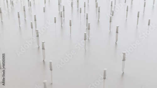 White Plastic Toy Hunting Knives scattered on a white surface with shallow depth of field