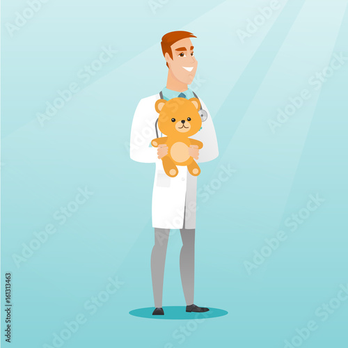Pediatrician doctor holding teddy bear.