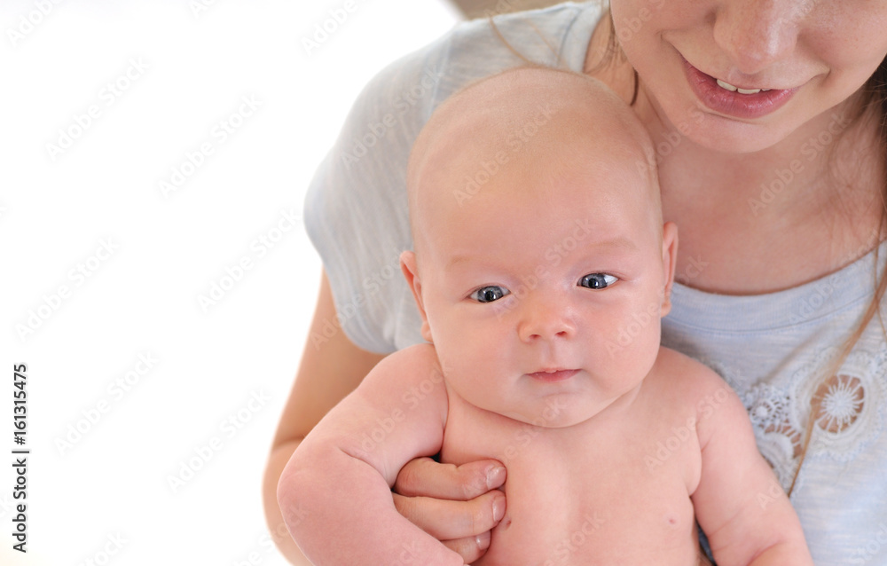 Young mother holding her newborn child. Young mother holding her newborn child.