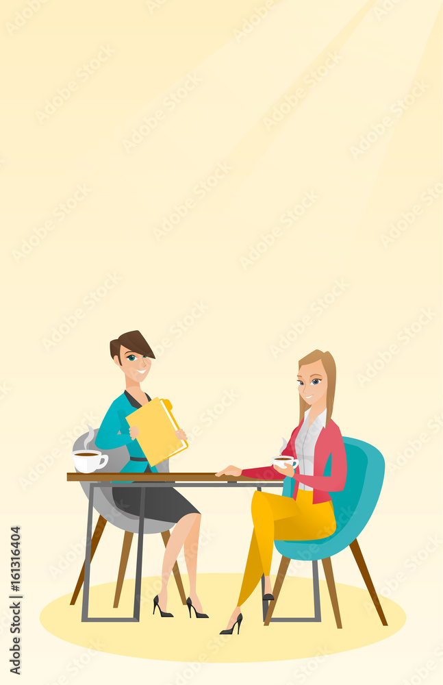Two businesswomen during business meeting.