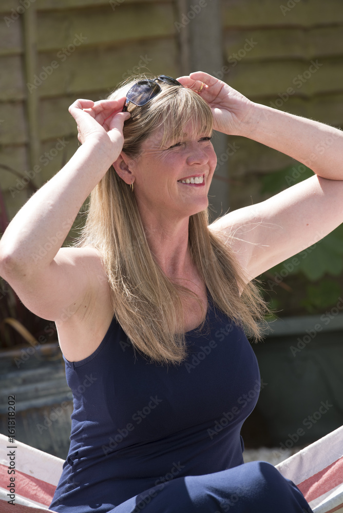 Woman with sun glasses in her hair Woman with sun glasses in her hair
