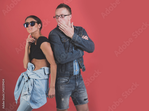 portrait of modern young people wearing jeans clothes and sunglasses
