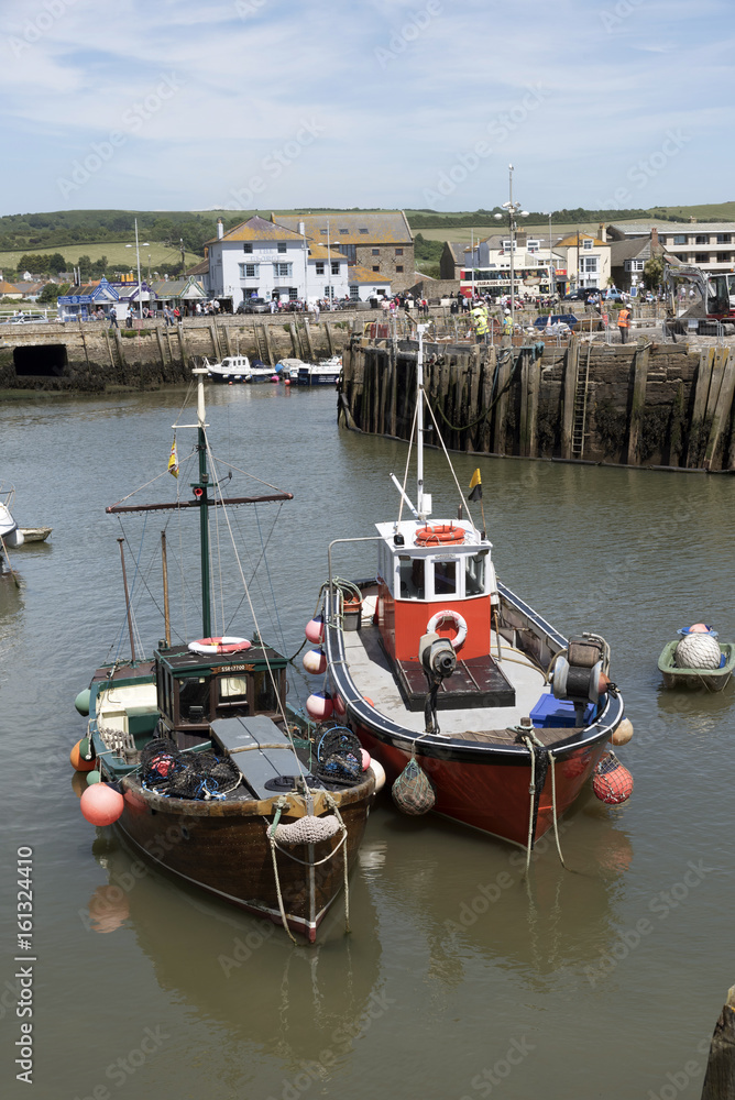 The harbor at West Bay on the Jurassic coast in West Dorset England UK. June 2017. Two commercial fishing boats in the harbour