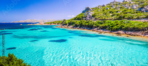 Emerald green sea water and rocks on coast of Maddalena island, Sardinia, Italy photo