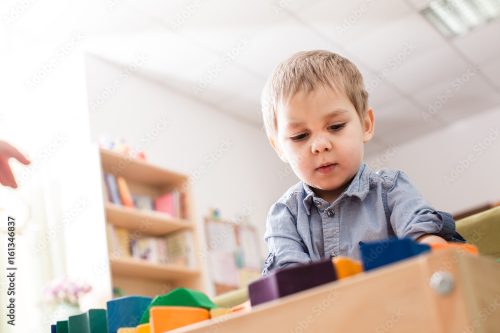 Boy playing with cubes Boy playing with cubes