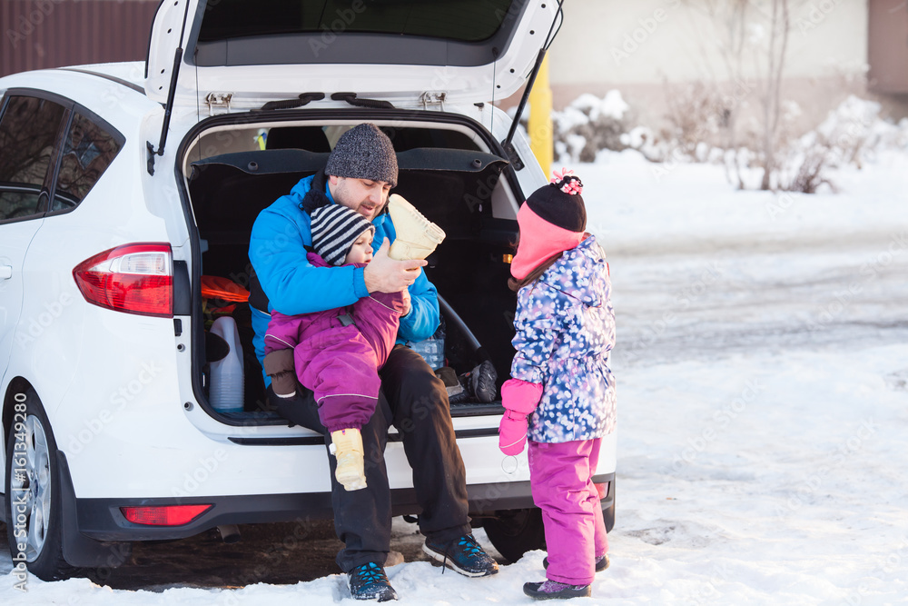 Dad with kids on winter vacation