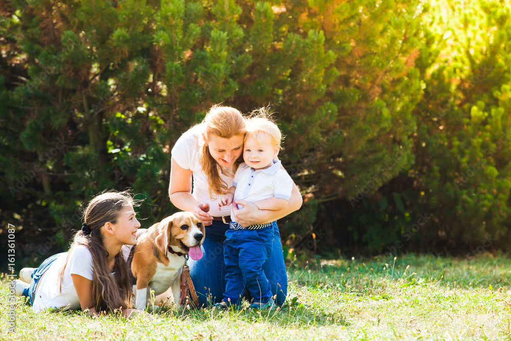 Fototapeta premium Mom with kids on a walk