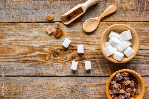 sugar cubes in bowls on stone table background top view mockup