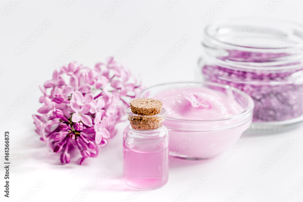 lilac natural cosmetic set for spa with cream white table background lilac natural cosmetic set for spa with cream white table background