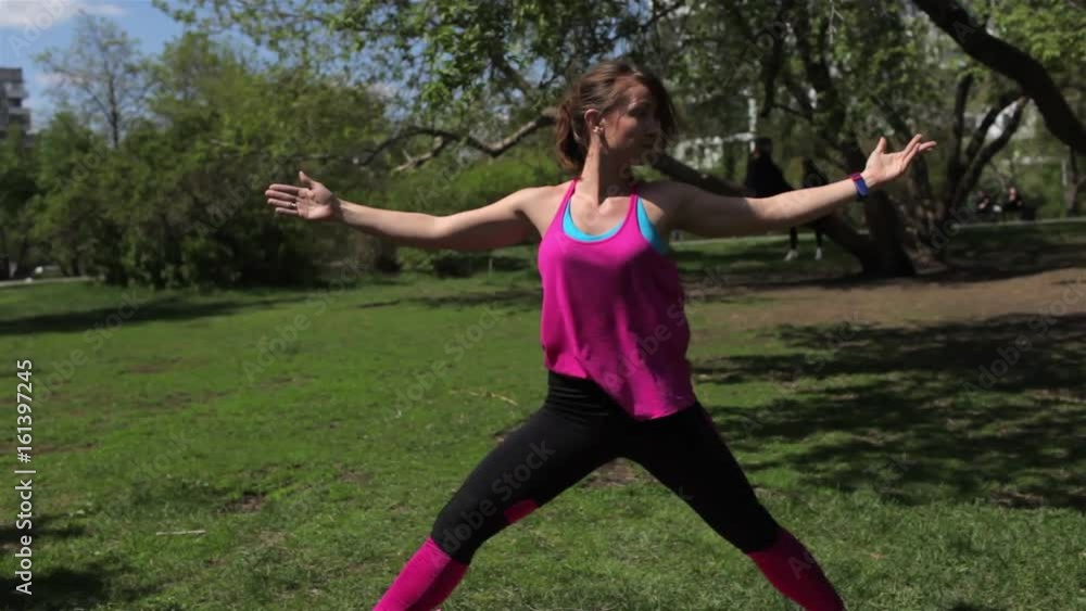 Sports Girl Doing Strength Training on Nature in the Park. Sports Lifestyle Sports Girl Doing Strength Training on Nature in the Park. Sports Lifestyle
