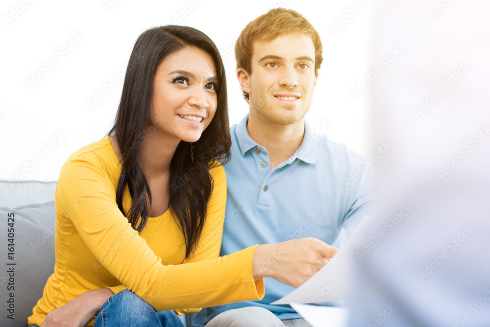 Young mixed race couple meeting with consultant Young mixed race couple meeting with consultant