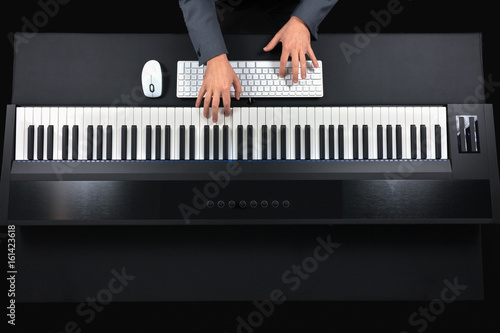Pianist playing electric piano with jacket photo
