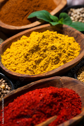 assortment of spices and herbs, selective focus, closeup vertical