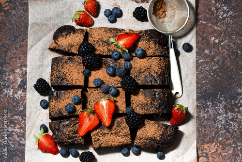 Fototapeta Naklejka Na Ścianę i Meble -  dessert - chocolate brownies with fresh berries, top view