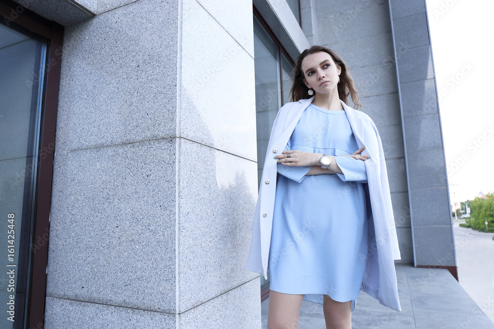 fashion portrait of young elegant woman outdoor in jacket, dress, glasses fashion portrait of young elegant woman outdoor in jacket, dress, glasses