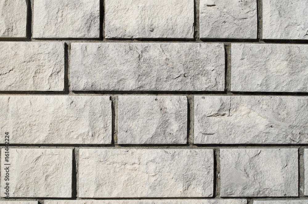 Naklejka premium New white stone wall closeup
