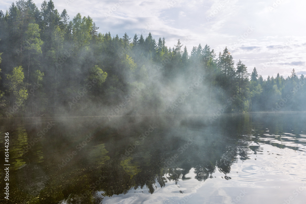 Smoke on the lake, summer in Finland