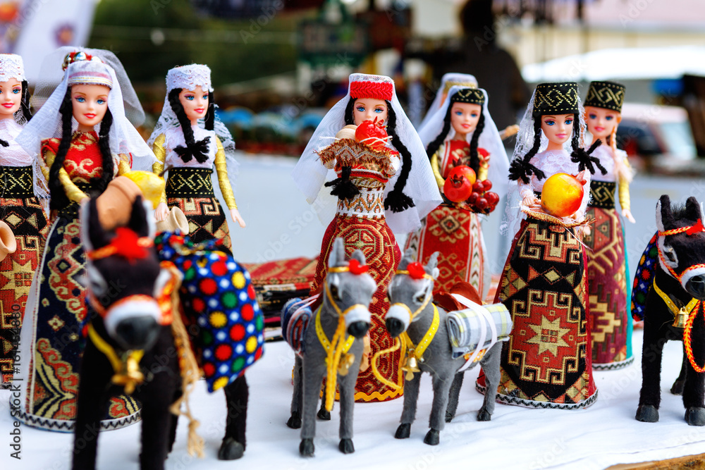 Armenian ancient doll souvenir made from cloth fabric in national costumes sold in the market