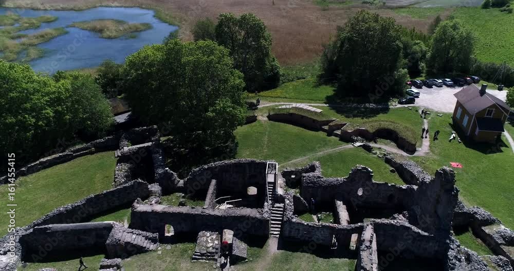Kuusisto castle ruins, Cinema 4k aerial view of a backward flight above kuusiston linnan rauniot, revealing the view on a sunny summer day, in Kaarina, Turku, Finland