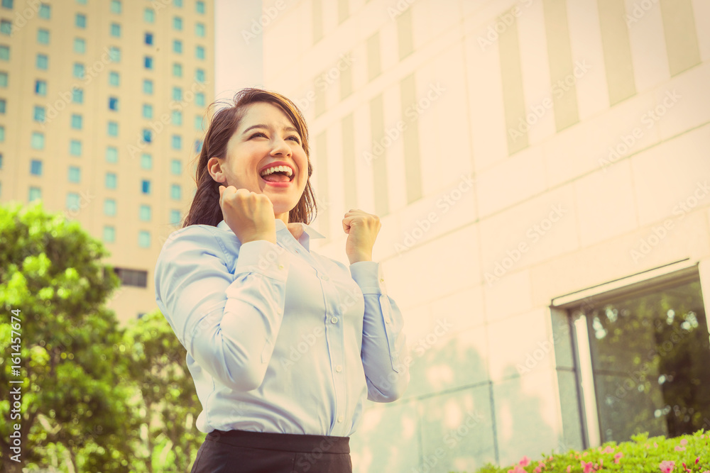 young woman doing fists pump. business motivation concept. young woman doing fists pump. business motivation concept.