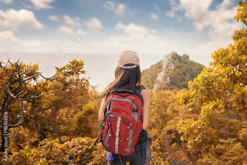 Woman tourist traveling with backpack hiking Travel Lifestyle concept adventure vacations