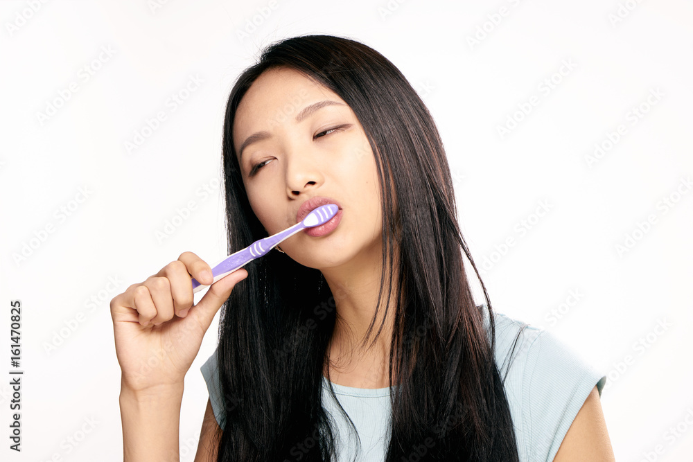 Oral hygiene, toothbrush, teeth care, woman brushes teeth, woman on isolated background Oral hygiene, toothbrush, teeth care, woman brushes teeth, woman on isolated background