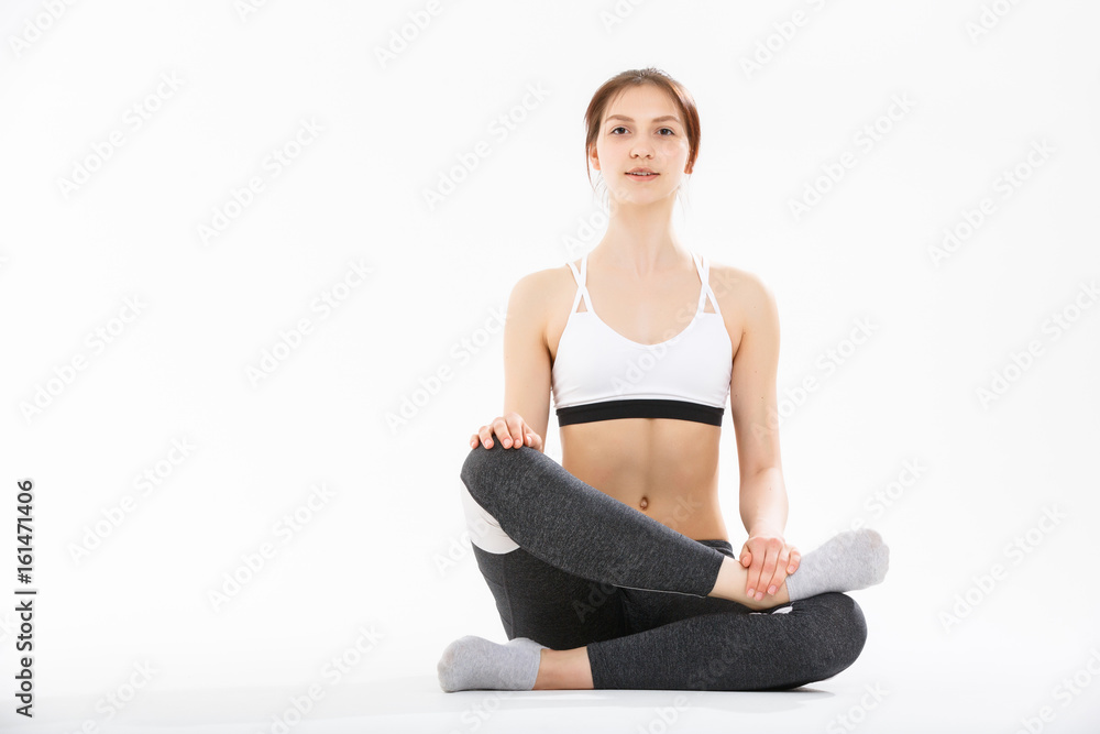 Young woman exercise yoga supported headstand