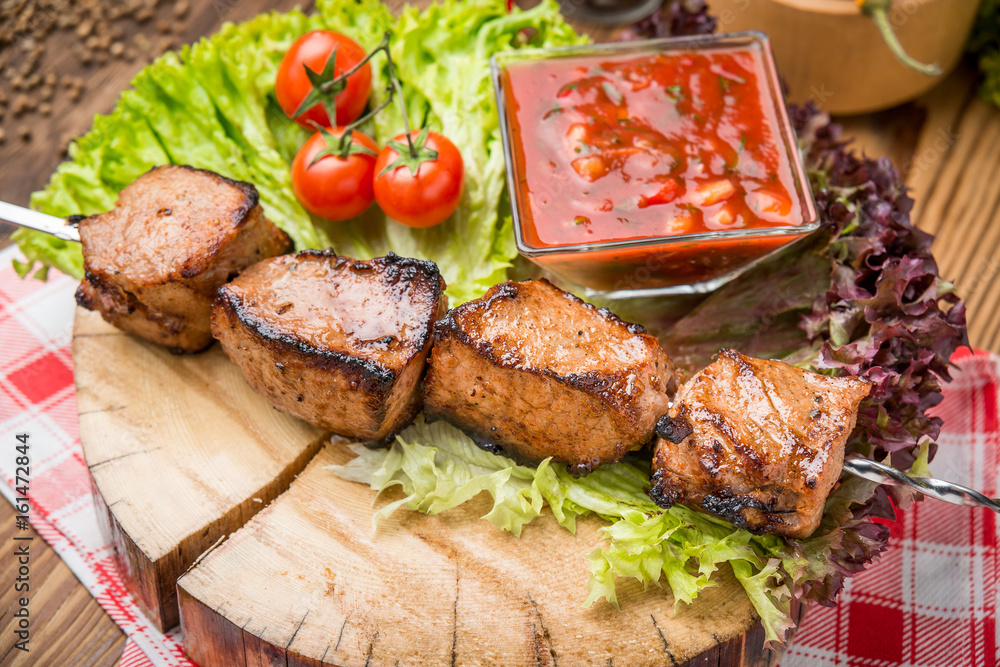 Delicious juicy skewered meat or shish kebabs on skewers of pork tenderloin Delicious juicy skewered meat or shish kebabs on skewers of pork tenderloin
