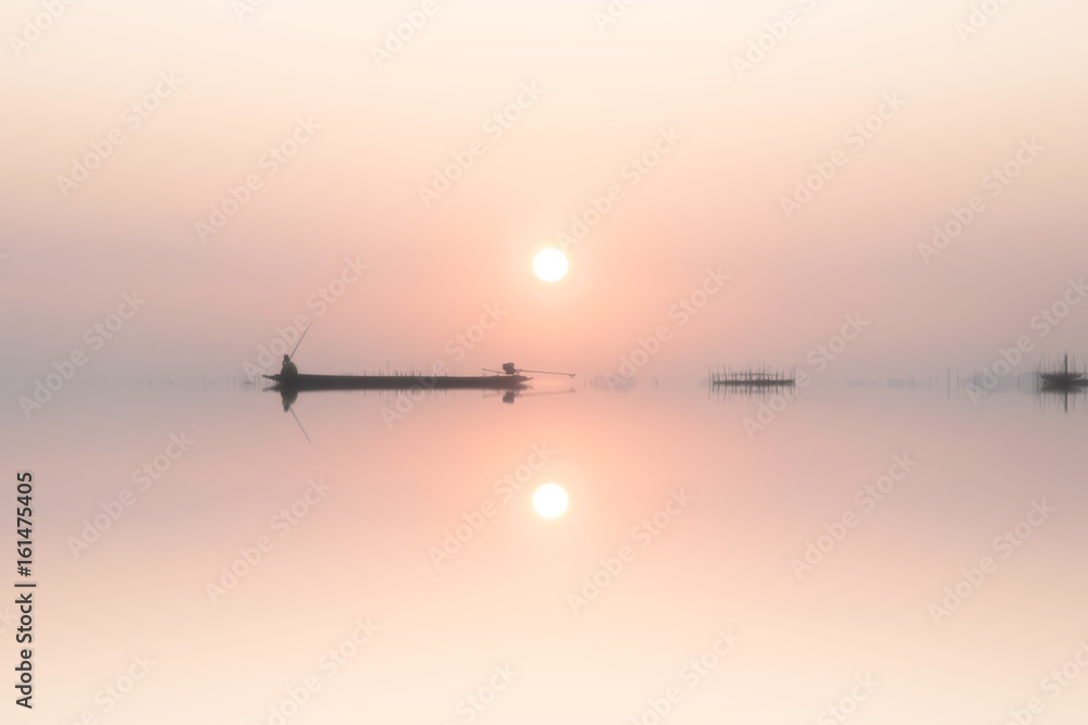 Mirror image of silhouette fisherman with sunset sky on the lake. Mirror image of silhouette fisherman with sunset sky on the lake.