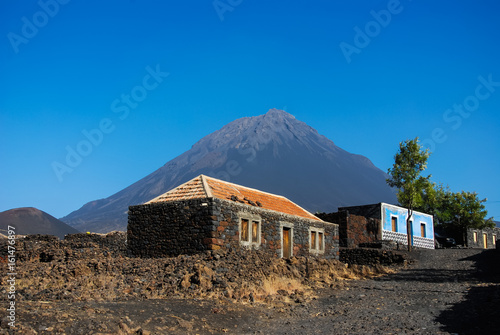 Cabo Verde, Pico do Fogo, Caldera. Volcano Pico do Fogo, 2829 m, the highest mountain of Cabo Verde standing isolated in the burned Lava fields. Hauses of igneous rocks in the Cha das Caldeiras