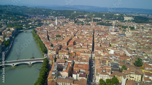 Fototapeta Naklejka Na Ścianę i Meble -  Aerial video shooting with drone of Verona, city on the Adige river in Veneto famous for Romeo and Juliet a Shakespeare’s play, has been awarded World Heritage Site status by UNESCO