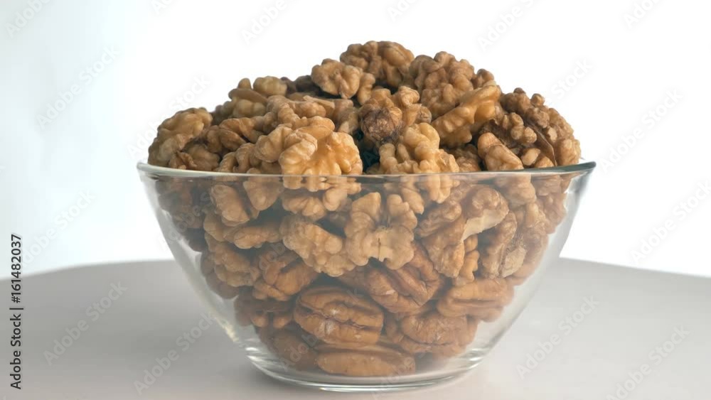 The nut walnut rotates on the turntable. The nut walnut rotates on the turntable.