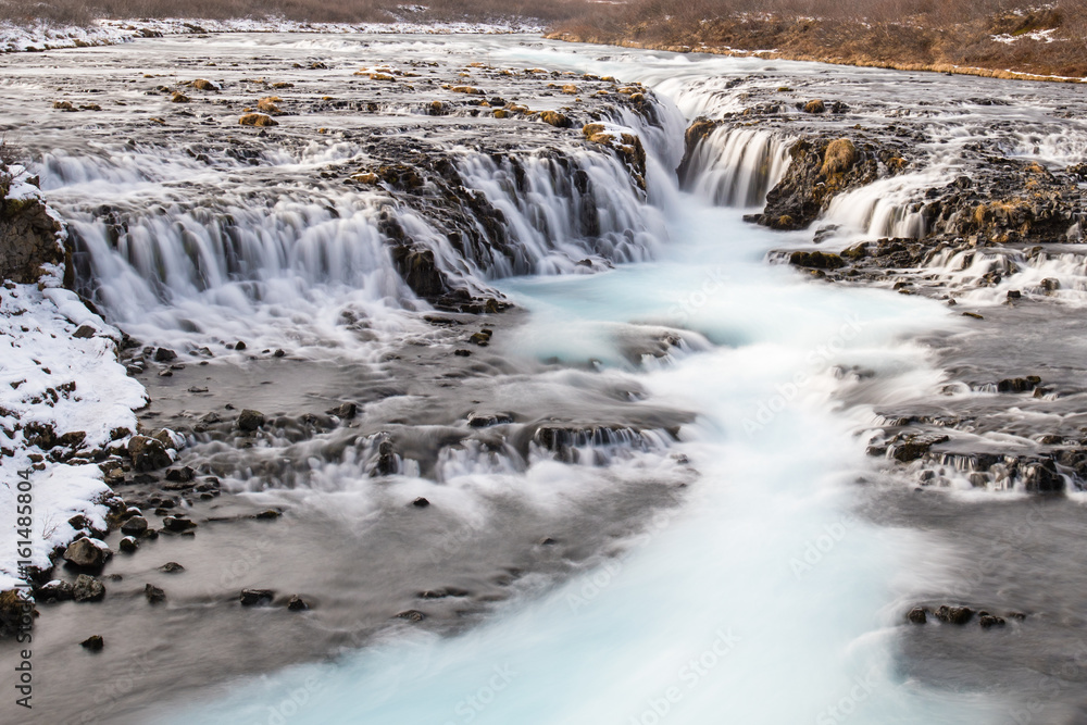 Fototapeta premium Bruarfoss (Blue Waterfall) at the south of Iceland in winter.