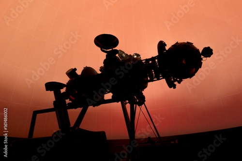 silhouette of planetarium projector, star projector.