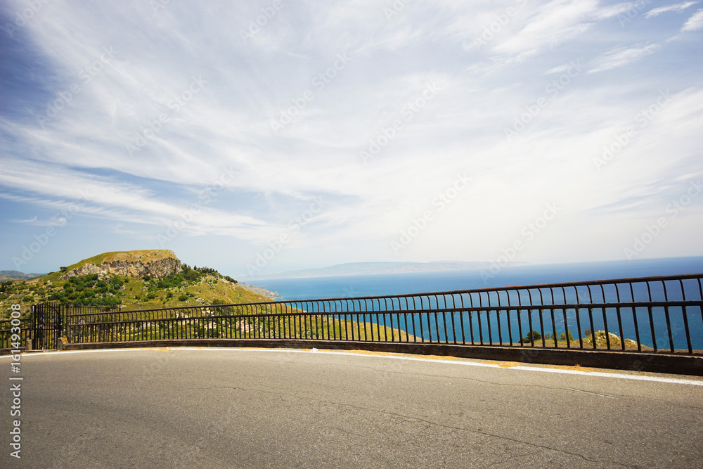 Mountain road to a small Sicilian village Castelmola with a panoramic view of mediterranean sea and mainland Italy.