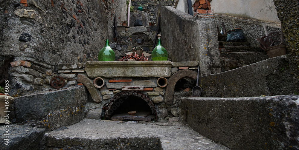 Old brick stove decoration in Francavilla di Sicilia, Italy.