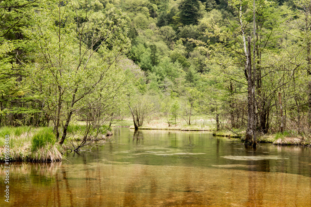 Hotaka mountain range and taisho ike pond in spring at kamikochi national park nagano japan Hotaka mountain range and taisho ike pond in spring at kamikochi national park nagano japan