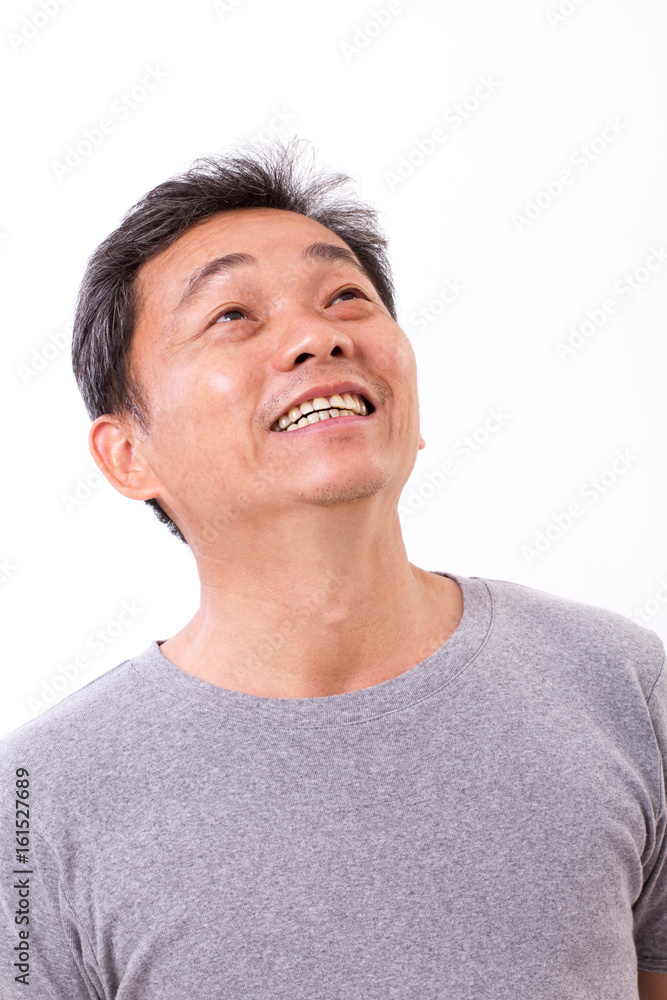 happy smiling middle aged man looking up, white isolated background happy smiling middle aged man looking up, white isolated background