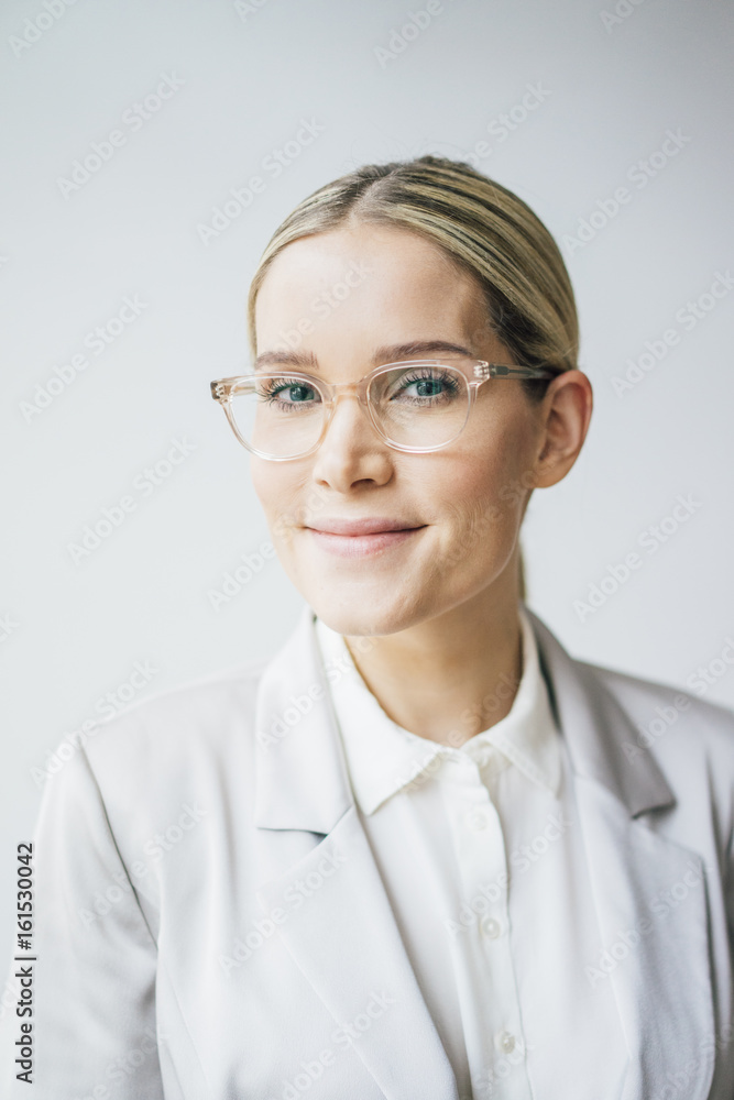 Portrait of blond businesswoman wearing glasses Portrait of blond businesswoman wearing glasses