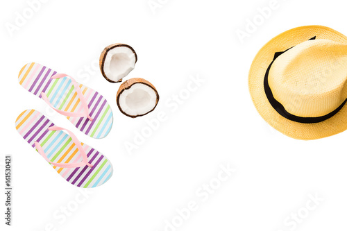 Summer accessories. Shoes, hat, coconut. Summertime background isolated on white. Flip flops top view. Striped slippers.