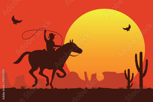 Rodeo cowboy riding a wild bull