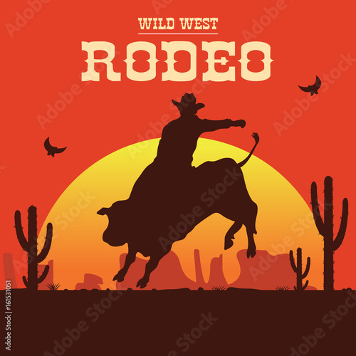 Rodeo cowboy riding a wild bull