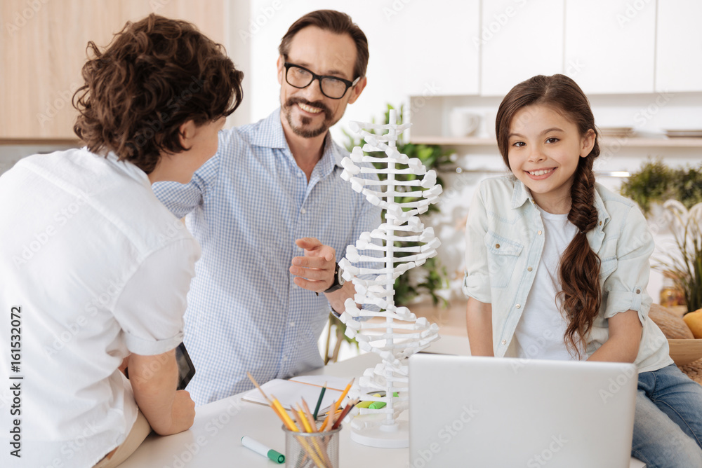 Sweet children discussing school with their father Sweet children discussing school with their father