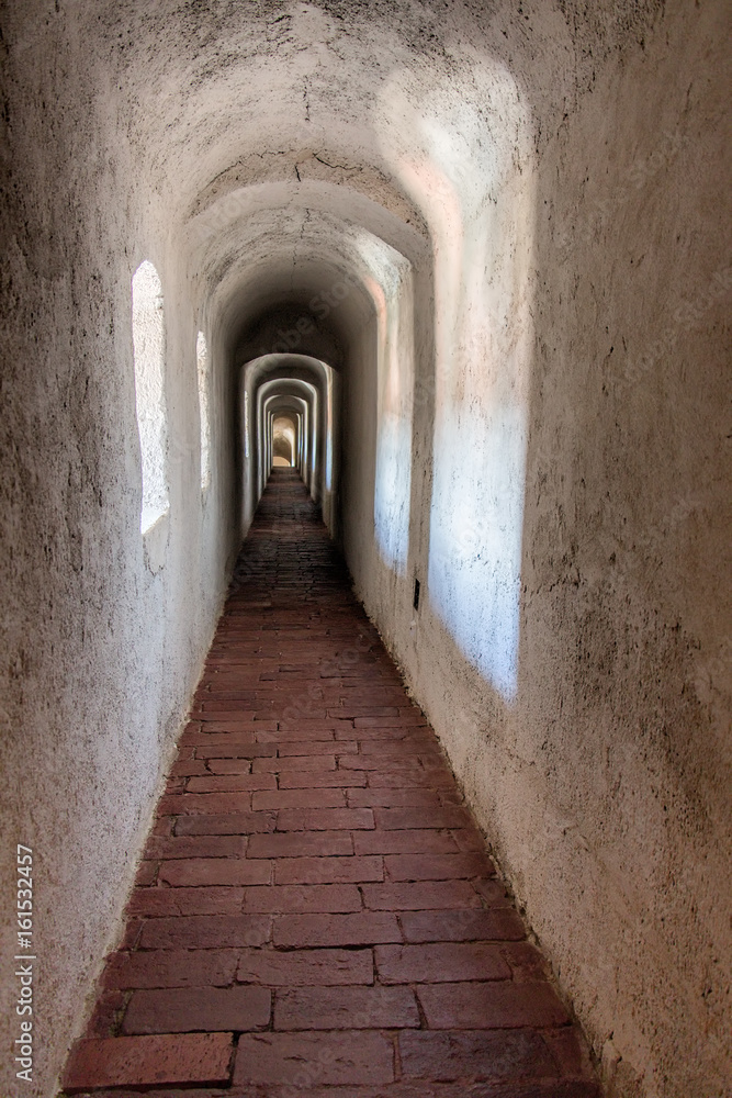 Long narrow corridor in an old antique building.
