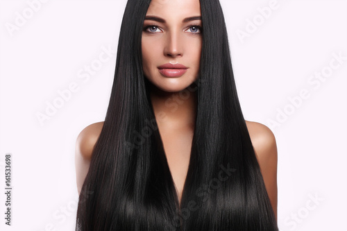 beautiful woman with long hair and make-up photo