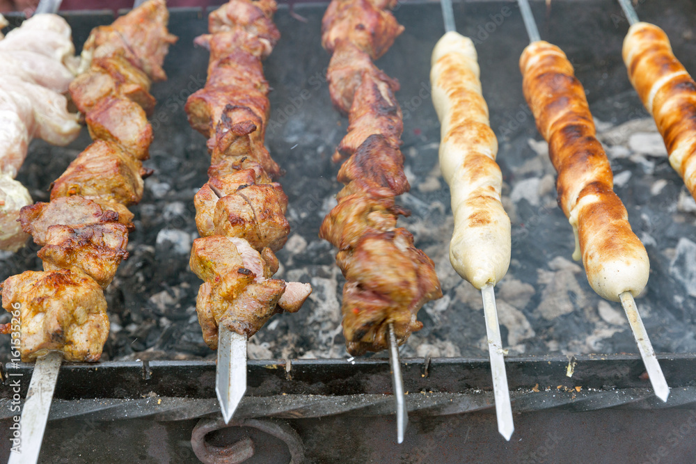 Shish kebab and shashlik on a grill outdoors