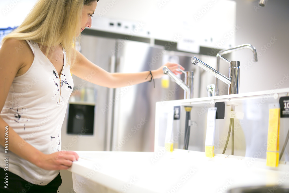 woman shopping for furniture in a furniture store woman shopping for furniture in a furniture store